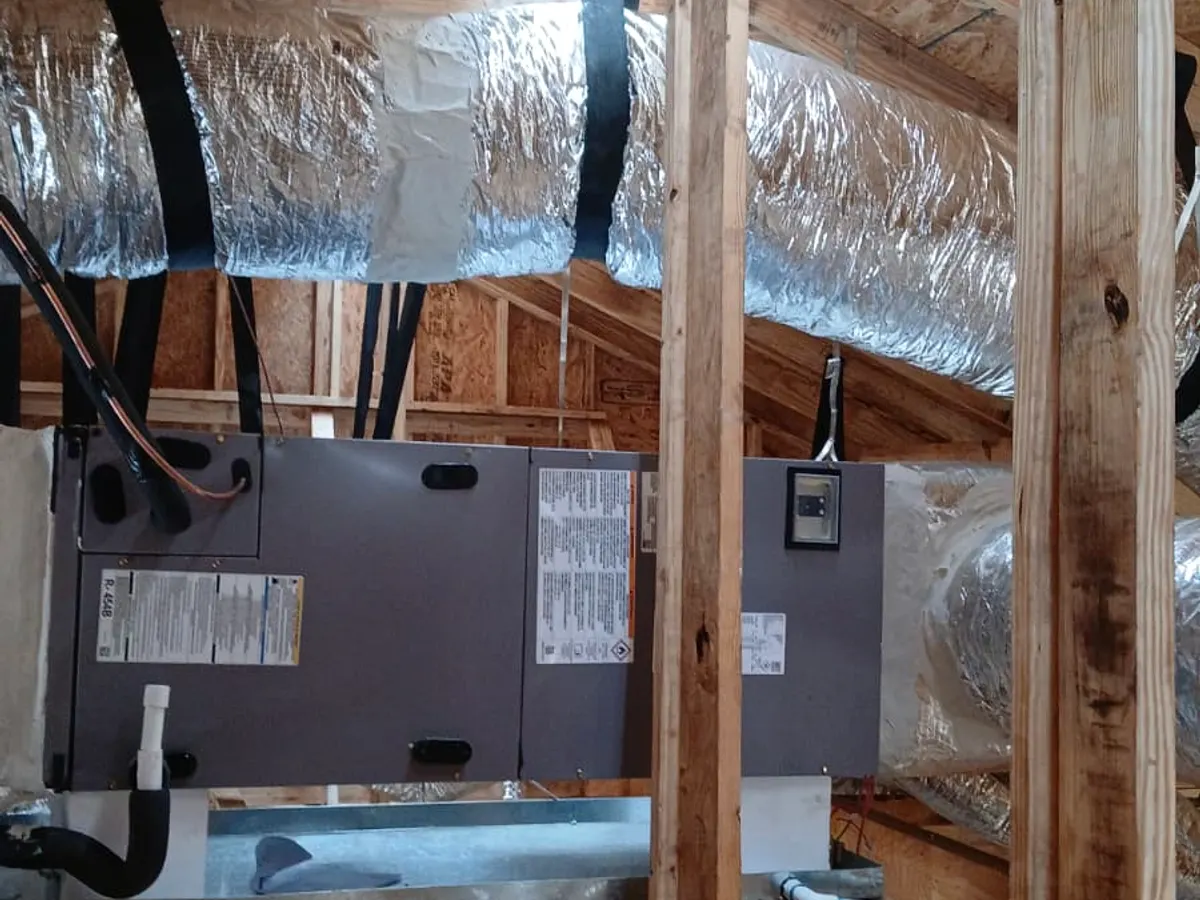 Air handler under a canopy of insulated flex duct in an attic